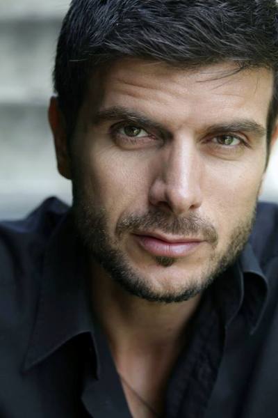 Manos Gavras as Hades